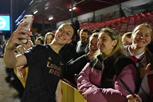 Brighton And Hove Albion Women V Arsenal Women 2022-23 Prints: Arsenal Women's Player Lotte Wubben-Moy Interacts with Fan after Brighton Match