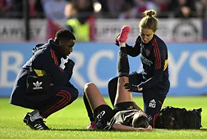 Brighton And Hove Albion Women V Arsenal Women 2022-23 Prints: Arsenal Women's Star Gio Queiroz Receives Treatment from Physio during Brighton Match