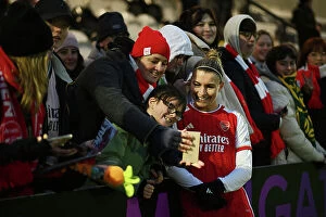 Images Dated 26th November 2023: Arsenal Women's Super League Triumph: Steph Catley Celebrates with Adoring Fans