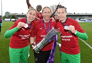 Arsenal Women's Team Celebrates WSL Title with Goalkeepers Sari van Veenendaal, Leanne Hall, and Pauline Peyraud-Magnin
