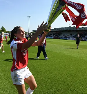 Arsenal Women's Victory: Katie McCabe Lifts the Conti Cup Trophy