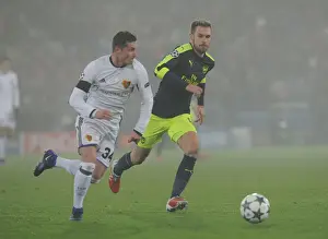 FC Basel V Arsenal 2016-17 Prints: Arsenal's Aaron Ramsey Clashes with Basel's Taulant Xhaka in UEFA Champions League Match