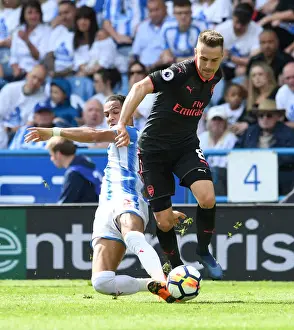 Huddersfield Town V Arsenal 2017-18 Prints: Arsenal's Aaron Ramsey Clashes with Huddersfield's Tom Ince in Premier League Showdown