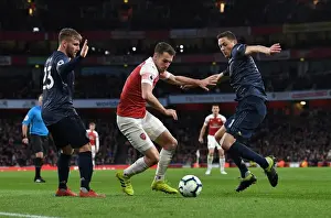 Arsenal's Aaron Ramsey Clashes with Manchester United's Luke Shaw and Nemanja Matic