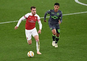 Images Dated 8th November 2018: Arsenal's Aaron Ramsey Clashes with Sporting CP's Fredy Montero in Europa League Showdown