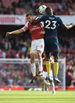Arsenal V West Ham United 2018-19 Prints: Arsenal's Aaron Ramsey Clashes with West Ham's Issa Diop in Premier League Showdown