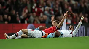 Arsenal V West Ham United 2013/14 Prints: Arsenal's Aaron Ramsey Clashes with West Ham's Ricardo Vaz Te in Intense Premier League Match