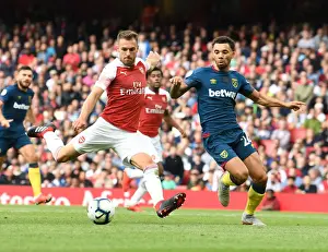 Arsenal V West Ham United 2018-19 Prints: Arsenal's Aaron Ramsey Clashes with West Ham's Ryan Fredericks in Premier League Showdown