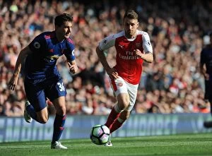 Images Dated 7th May 2017: Arsenal's Aaron Ramsey Closes In on Manchester United's Matteo Darmian in Intense Premier League