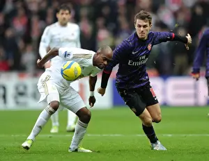 Swansea V Arsenal - FA Cup 3rd Rd 2012-13 Prints: Arsenal's Aaron Ramsey Closes In on Swansea's Dwight Tiendalli in FA Cup Showdown