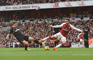 Images Dated 28th October 2017: Arsenal's Aaron Ramsey Evades Swansea's Tom Carroll