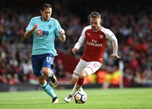 Arsenal v AFC Bournemouth 2017-18 Collection: Arsenal's Aaron Ramsey Faces Off Against AFC Bournemouth's Charlie Daniels in Premier League Clash