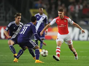 Arsenal's Aaron Ramsey Faces Off Against Anderlecht Duo Youri Tielemans and Dennis Praet in UEFA Champions League Clash