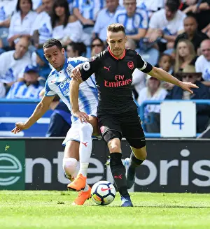 Huddersfield Town V Arsenal 2017-18 Prints: Arsenal's Aaron Ramsey Faces Off Against Huddersfield's Tom Ince in Premier League Clash