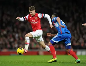 Arsenal V Hull City 2013-14 Prints: Arsenal's Aaron Ramsey Faces Off Against Hull City's Jake Livermore in Premier League Clash