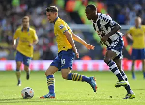 West Bromwich Albion V Arsenal 2013-14 Prints: Arsenal's Aaron Ramsey Faces Off Against Saido Berahino in Premier League Clash (West Bromwich Albion vs Arsenal)