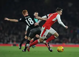 Arsenal V Southampton EFL Cup 2016-17 Prints: Arsenal's Aaron Ramsey Faces Off Against Southampton's Harrison Reed in EFL Cup Clash