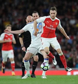 Images Dated 16th May 2017: Arsenal's Aaron Ramsey Faces Off Against Sunderland's John O'Shea in Premier League Showdown