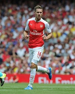 Images Dated 9th August 2015: Arsenal's Aaron Ramsey Faces Off Against West Ham United in Intense 2015-16 Premier League Clash