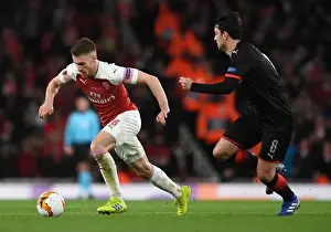 Arsenal V Stade Rennais 2018-19 Prints: Arsenal's Aaron Ramsey Fends Off Clement Grenier in Europa League Clash