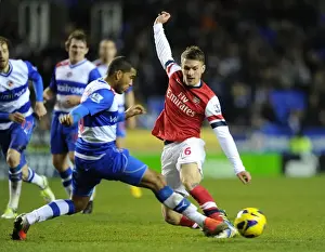 Reading V Arsenal 2012-13 Prints: Arsenal's Aaron Ramsey Fends Off Reading's Adrian Mariappa