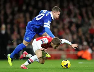 Arsenal V Everton 2013-14 Prints: Arsenal's Aaron Ramsey Fouls by Everton's Ross Barkley in Premier League Clash (2013-14)