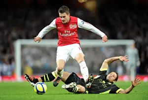 Arsenal's Aaron Ramsey Leaps Over Leeds Michael Brown in FA Cup Clash