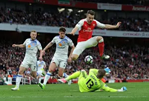 Arsenal V Sunderland 2016-17 Prints: Arsenal's Aaron Ramsey Leaps Over Sunderland's Jordan Pickford