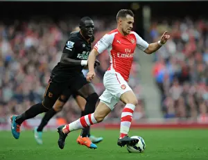 Arsenal V Hull City 2014-15 Prints: Arsenal's Aaron Ramsey Outmaneuvers Hull's Mohamed Diame