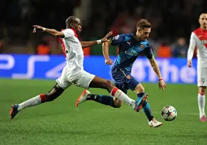 Monaco V Arsenal 2014/15 Prints: Arsenal's Aaron Ramsey Outmaneuvers Monaco's Geoffrey Kondogbia in UEFA Champions League Clash