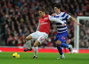 Arsenal V Queens Park Rangers 2011-12 Prints: Arsenal's Aaron Ramsey Outmaneuvers QPR's Alejandro Faurlin