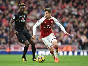 Images Dated 28th October 2017: Arsenal's Aaron Ramsey Outmaneuvers Swansea's Tammy Abraham