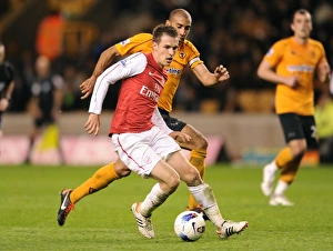 Wolverhampton Wanderers V Arsenal 2011-12 Prints: Arsenal's Aaron Ramsey Outsmarts Carl Henry
