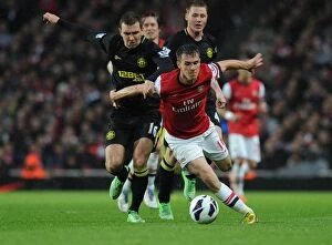 Wigan Athletic Collection: Arsenal's Aaron Ramsey Outsmarts James McArthur with a Masterful Dribble, 2012-13
