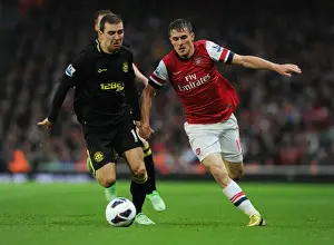 Arsenal V Wigan Athletic 2012-13 Prints: Arsenal's Aaron Ramsey Outsmarts James McArthur: The Skillful Pass at Emirates Stadium