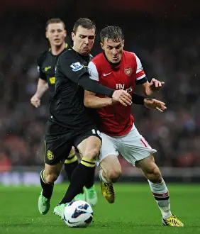 Arsenal V Wigan Athletic 2012-13 Prints: Arsenal's Aaron Ramsey Outwits James McArthur: Premier League Battle