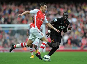 Arsenal V Hull City 2014-15 Prints: Arsenal's Aaron Ramsey Outwits Mohamed Diame: A Moment of Brilliance from the 2014 Arsenal vs Hull City Match