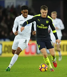 Swansea City V Arsenal - 2016-17 Prints: Arsenal's Aaron Ramsey Outwits Swansea's Leroy Fer in Thrilling Premier League Clash