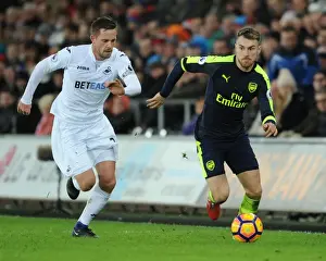 Swansea City V Arsenal - 2016-17 Prints: Arsenal's Aaron Ramsey Outwits Swansea's Sigurdsson: Intense Premier League Battle