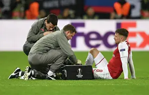 CSKA Moscow V Arsenal 2017-18 Prints: Arsenal's Aaron Ramsey Receives Medical Attention from Colin Lewin and Gary O'Driscoll during CSKA Moscow Match