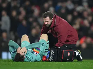 Manchester United V Arsenal 2018-19 Prints: Arsenal's Aaron Ramsey Receives Treatment During Manchester United Clash (2018-19)