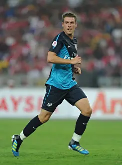 Malaysia XI V Arsenal Prints: Arsenal's Aaron Ramsey Scores Hat-Trick in 4-0 Crushing of Malaysia XI at Bukit Jalil Stadium