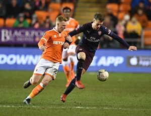 Images Dated 5th January 2019: Arsenal's Aaron Ramsey Scores Past Blackpool's Callum Guy in FA Cup Third Round