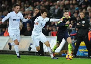 Swansea City V Arsenal - 2016-17 Prints: Arsenal's Aaron Ramsey Scores Past Swansea's Ki and Sigurdsson (January 2017)