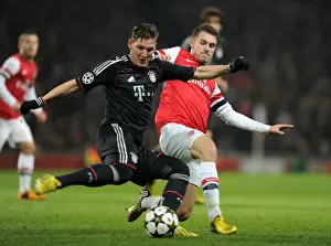 Arsenal's Aaron Ramsey Tackles Bastian Schweinsteiger in Intense Arsenal v Bayern Munich UCL Clash