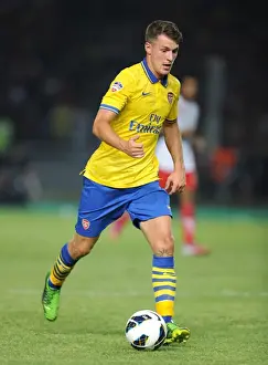 Indonesia Dream Team V Arsenal 2013-14 Prints: Arsenal's Aaron Ramsey Takes on Indonesia All-Stars in 2013 Showdown