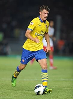 Indonesia Dream Team v Arsenal 2013-14 Collection: Arsenal's Aaron Ramsey Takes on Indonesia All-Stars in 2013 Showdown
