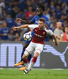 Arsenal V Chelsea - Pre Season 2017-18 Prints: Arsenal's Aaron Ramsey vs. Chelsea's Victor Moses: A Battle in the Pre-Season Friendly in Beijing