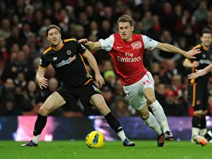 Arsenal V Wolverhampton Wanderers 2011-2012 Prints: Arsenal's Aaron Ramsey vs. Wolves Stephen Ward: A Football Rivalry Erupts on the Pitch
