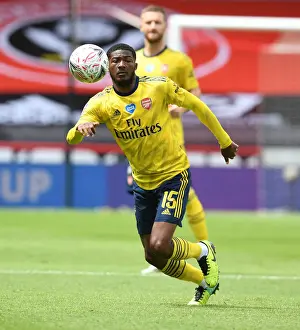 Arsenal's Ainsley Maitland-Niles in Action: FA Cup Quarterfinal Showdown vs Sheffield United